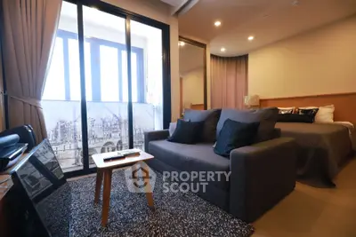 Modern studio apartment with cozy living area and stylish decor