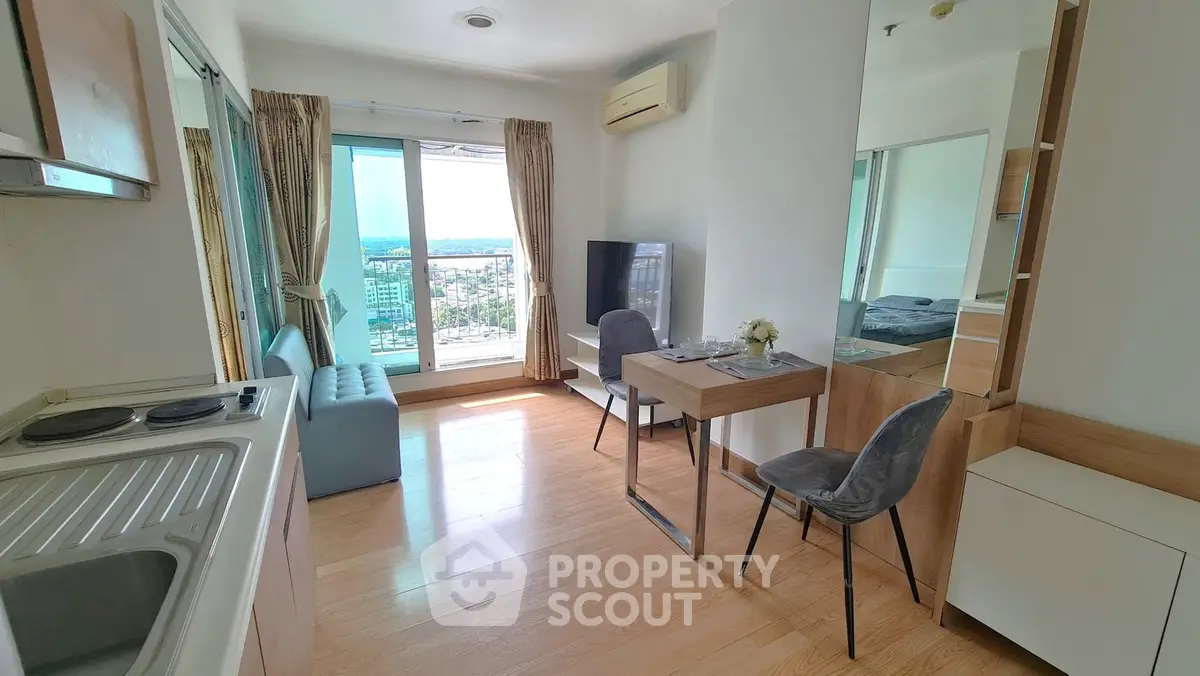 Modern apartment living room with open kitchen and stunning city view