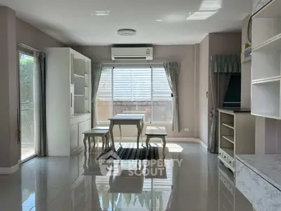 Bright dining area with modern furniture and large windows in a stylish home