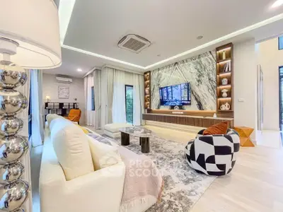 Luxurious modern living room with elegant decor and marble accent wall