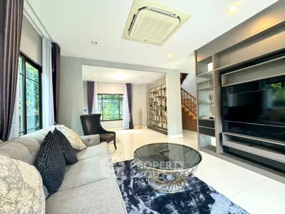 Spacious modern living room with elegant decor and large windows
