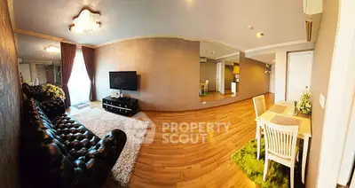 Spacious living room with elegant decor and open dining area