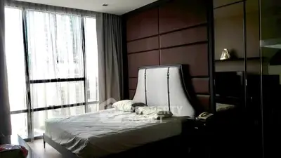 Luxurious bedroom with modern design and large window view