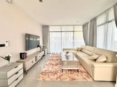 Spacious modern living room with elegant decor and large windows