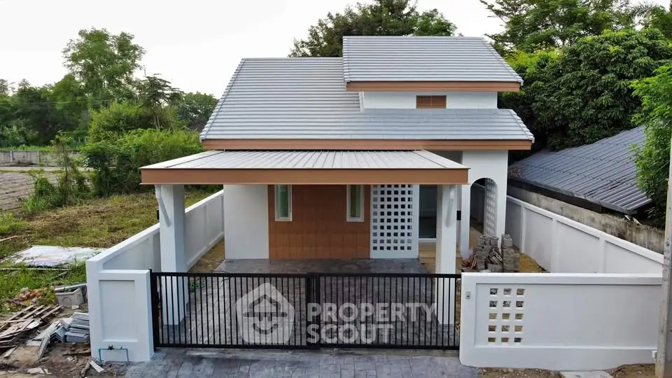 Charming single-story house with modern design and spacious driveway