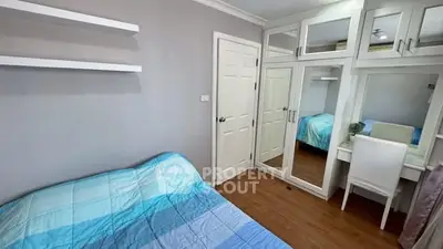 Cozy bedroom with mirrored wardrobe and modern decor