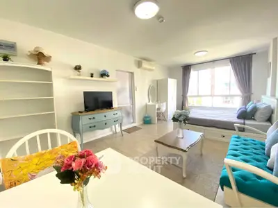Bright and airy living room with modern decor and large windows in a stylish apartment.