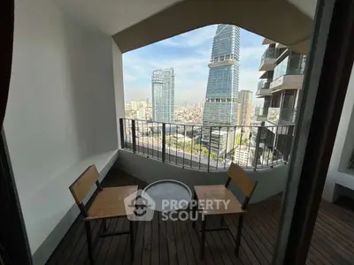 Stunning balcony view with modern cityscape and cozy seating area.