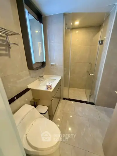 Modern bathroom with sleek design and glass shower enclosure