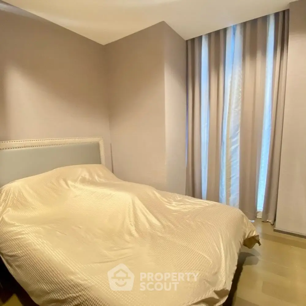 Cozy bedroom with elegant curtains and soft lighting