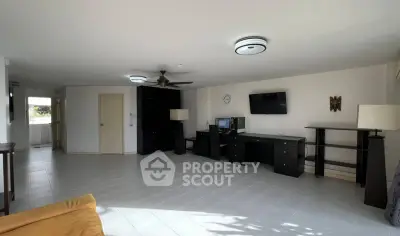 Spacious living room with modern furniture and ample natural light