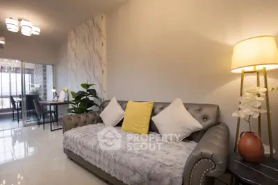 Elegant living room with plush sofa and modern decor, perfect for relaxation and entertaining.