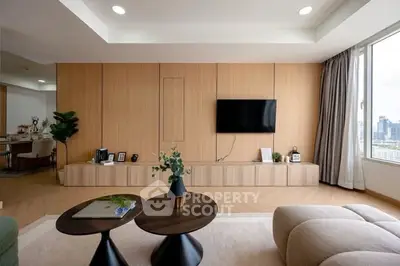 Modern living room with sleek wooden paneling and city view window