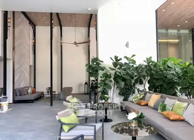 Luxurious modern living room with stylish furniture and lush indoor plants