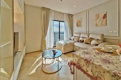 Spacious living room with elegant decor and large window offering stunning views.