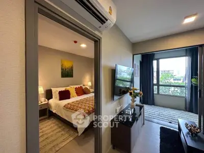 Modern apartment interior with cozy bedroom and stylish living room, featuring large windows and contemporary decor.
