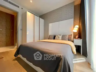 Modern bedroom with stylish decor and ample natural light