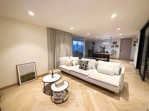 Spacious modern living room with stylish decor and open layout, perfect for entertaining.