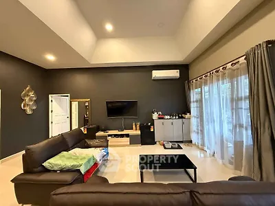 Spacious modern living room with high ceiling and elegant decor