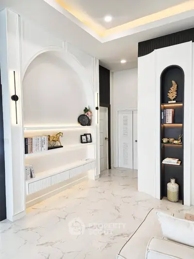 Elegant modern living room with built-in shelves and stylish decor