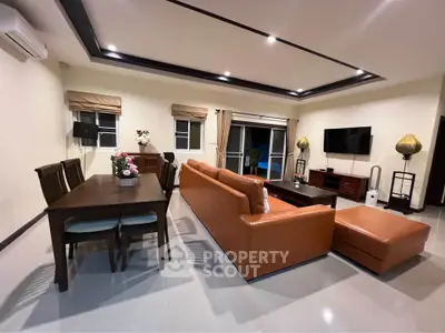 Spacious modern living room with elegant furniture and ambient lighting
