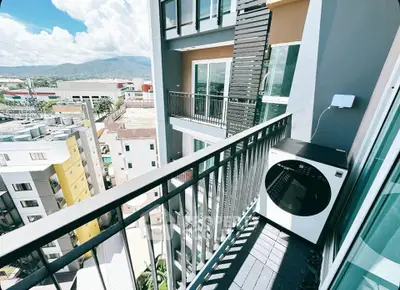 Modern apartment balcony with scenic city and mountain view