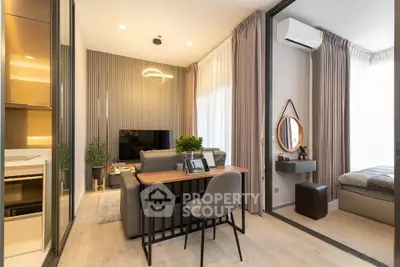 Modern open-plan living room with stylish decor and natural light