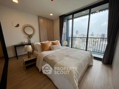 Luxurious bedroom with stunning city view and elegant decor