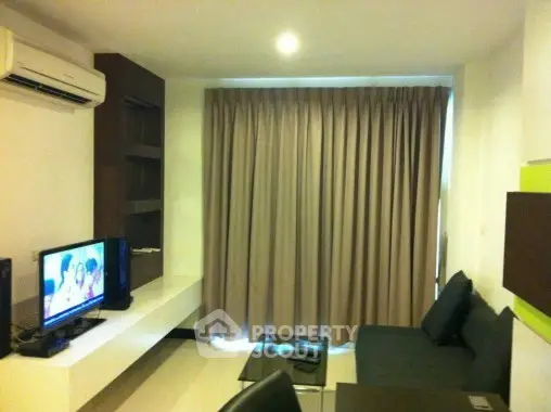 Modern living room with sleek furniture and entertainment setup