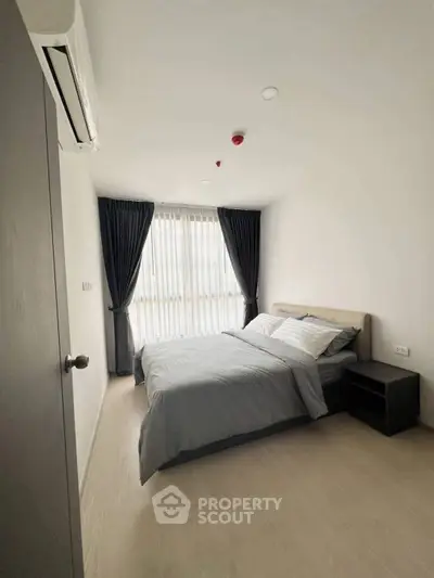 Modern bedroom with natural light and minimalist decor