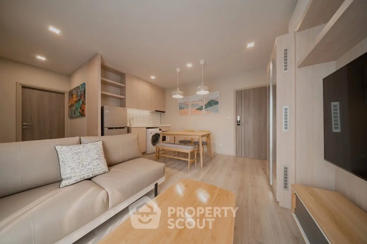 Modern living room with open kitchen and stylish decor