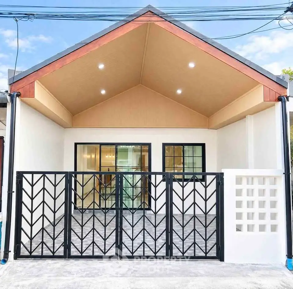 Charming modern house with stylish gate and spacious driveway