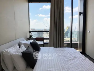 Luxurious bedroom with stunning city view and modern decor