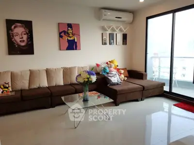 Stylish living room with modern decor and balcony access