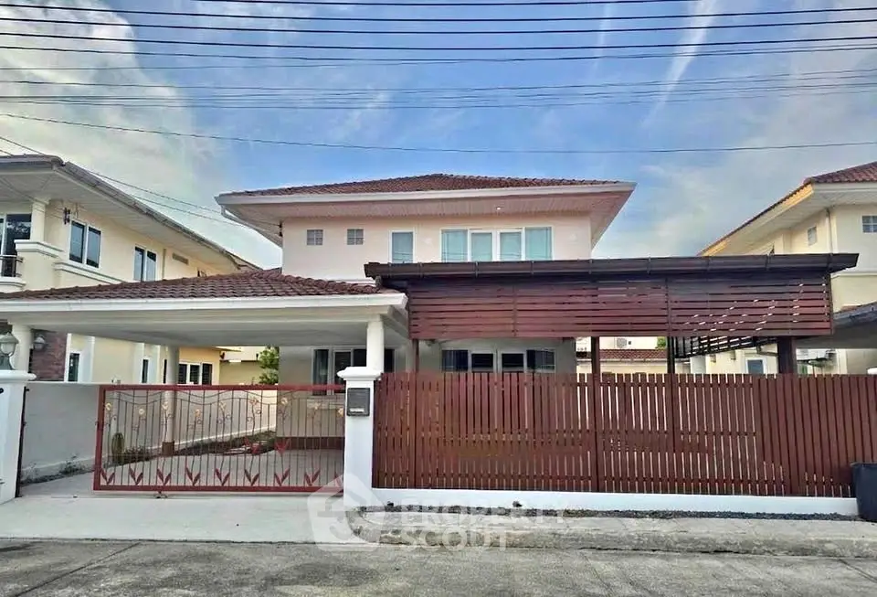 Charming two-story house with modern design and spacious driveway in a serene neighborhood.