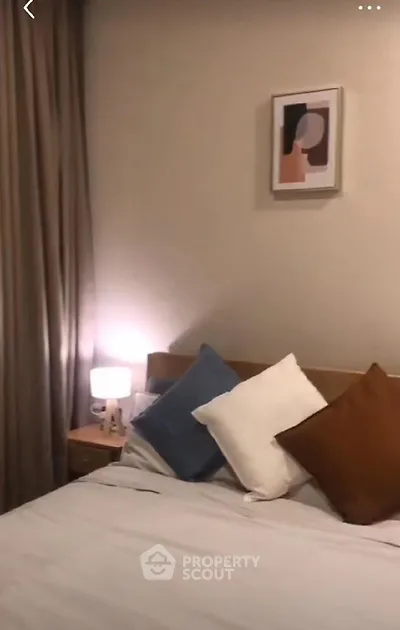 Cozy bedroom with stylish decor and soft lighting