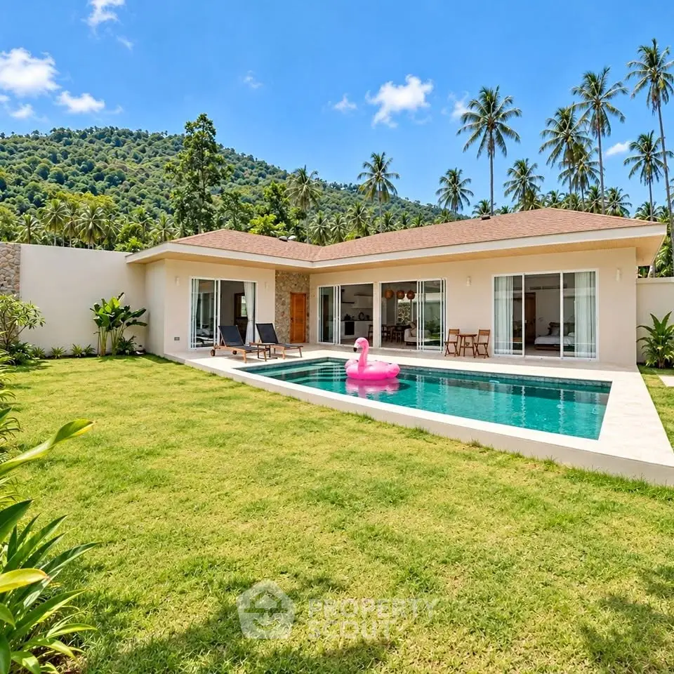 Luxurious villa with private pool and lush garden, nestled in tropical paradise with mountain views.