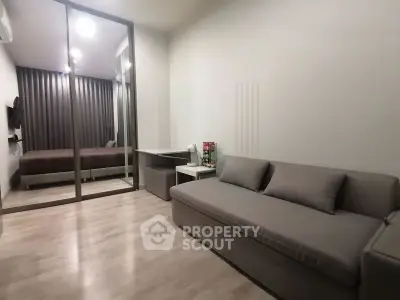 Modern apartment interior with cozy living room and bedroom view
