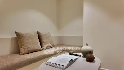 Cozy minimalist living area with neutral tones and modern decor