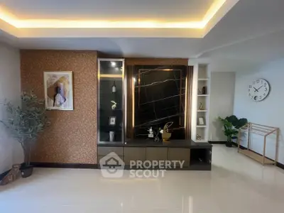Modern living room with stylish decor and elegant lighting