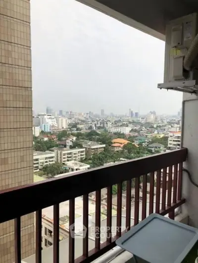 Stunning cityscape view from high-rise balcony with expansive skyline.