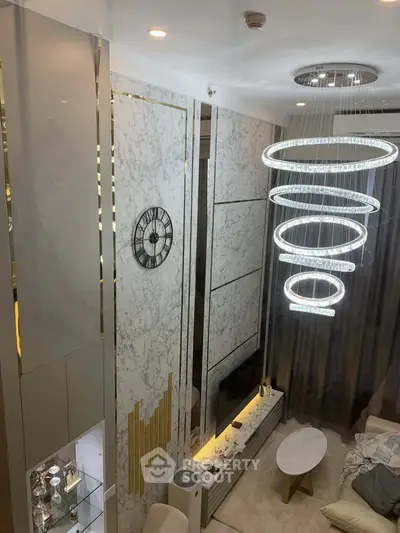 Luxurious modern living room with elegant chandelier and stylish decor