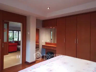 Spacious bedroom with built-in wardrobe and cozy decor