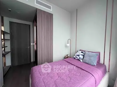 Cozy modern bedroom with stylish decor and ample natural light