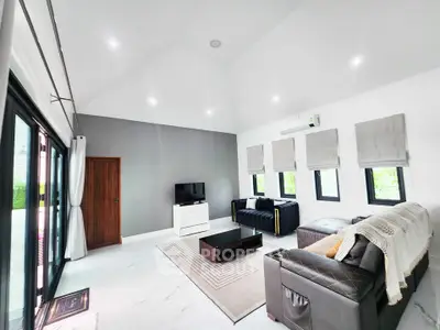 Spacious modern living room with sleek furniture and natural light