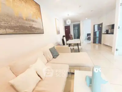 Spacious modern living room with elegant decor and open kitchen layout