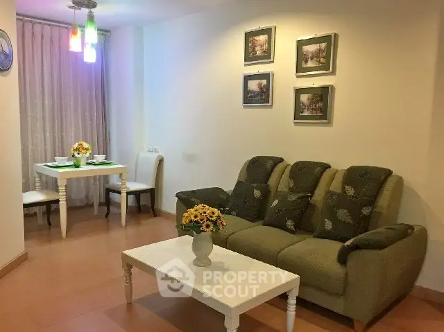 Cozy living room with elegant decor and dining area, perfect for relaxation and entertaining.