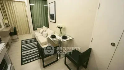 Modern living room with elegant dining area and cozy sofa in a stylish apartment.
