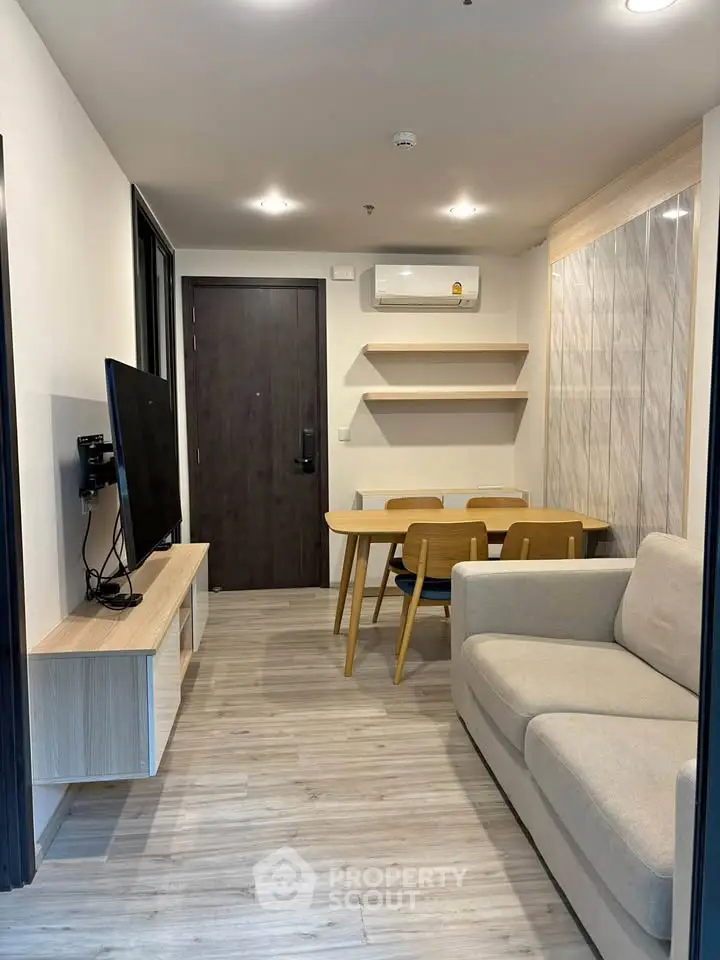 Modern living room with sleek furniture and stylish decor in a contemporary apartment.