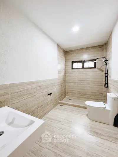 Modern minimalist bathroom with sleek fixtures and neutral tones